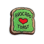 Custom avocado toast chenille patch featuring raised green towel embroidery, red heart detail, toast-shaped design, and premium stitched border for apparel and accessories
