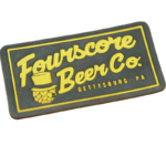 Custom embossed leather patch featuring the Fourscore Beer Co. logo with raised yellow lettering, premium black faux leather, and a rectangular design for hats, jackets, and apparel